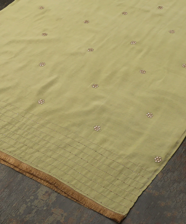 Discover the elegance of our Lime Green Silk Dupatta, adorned with intricate Gota floral booties and CoutureCraze lace. Perfect for weddings and festive occasions, this piece adds vibrant charm to any outfit.