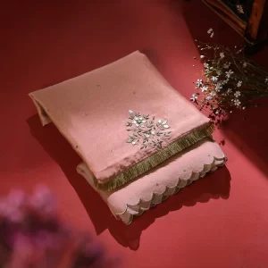 Add elegance to your look with our Pink Silk Dupatta featuring intricate gota patti work and a sheer organza border. Perfect for festive occasions. by couturecraze