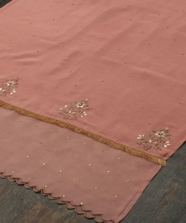 Add elegance to your look with our Pink Silk Dupatta featuring intricate gota patti work and a sheer organza border. Perfect for festive occasions. by couturecraze