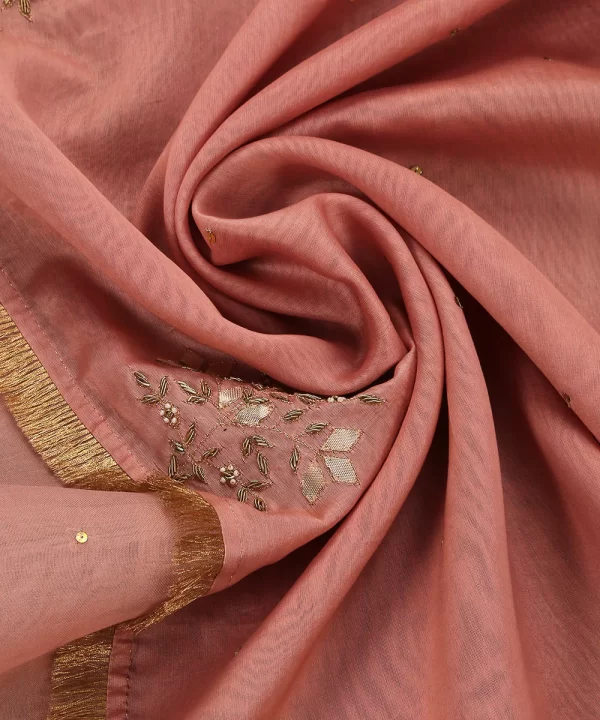 Add elegance to your look with our Pink Silk Dupatta featuring intricate gota patti work and a sheer organza border. Perfect for festive occasions. by couturecraze