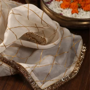 Elevate your ethnic look with our White Organza Dupatta featuring exquisite gota work. Perfect for weddings and festive occasions, this elegant piece adds sophistication to any outfit couturecraze .