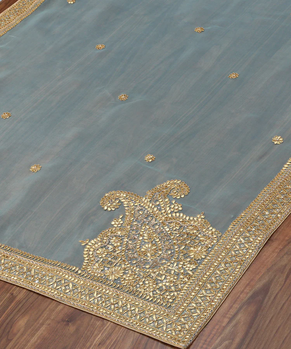 Elegant Sea Blue Handloom Organza Dupatta with Gota Patti Work – A beautifully crafted traditional dupatta with intricate gota patti embroidery on a soft organza base. Perfect for weddings, festive occasions, and traditional wear, this dupatta combines luxury with timeless charm. Sea Blue Handloom Zardozi Organza Dupatta