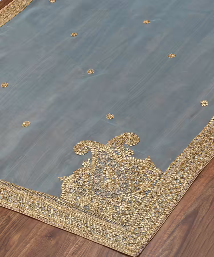 Elegant Sea Blue Handloom Organza Dupatta with Gota Patti Work – A beautifully crafted traditional dupatta with intricate gota patti embroidery on a soft organza base. Perfect for weddings, festive occasions, and traditional wear, this dupatta combines luxury with timeless charm. Sea Blue Handloom Zardozi Organza Dupatta