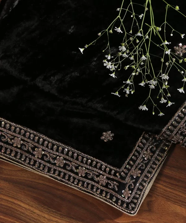 Discover the elegance of our Black Velvet Dupatta featuring intricate zardozi hand-embroidered borders by CoutureCraze. A luxurious addition to your festive wardrobe.