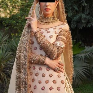 CoutureCraze blush pink gold embroidered lehenga set with star motifs and heavy threadwork