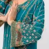 Detailed golden and beadwork embroidery on teal dress sleeve.