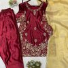 Sleeve close-up: Intricate gold floral embroidery detail on maroon ethnic dress sleeve.