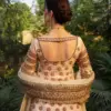 CoutureCraze blush pink gold embroidered lehenga set with star motifs and heavy threadwork
