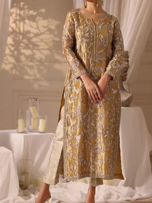 Luxury golden ethnic dress for women, featuring silver floral hand embroidery, full sleeves, and straight fit, ideal for festive occasions.