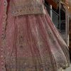Heavy gold embroidery and sequin work on pink bridal lehenga skirt
