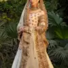 CoutureCraze blush pink gold embroidered lehenga set with star motifs and heavy threadwork