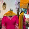 Embroidery closeup: hot pink CoutureCraze suit with pearl tassels and mustard dupatta