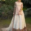 CoutureCraze blush pink gold embroidered lehenga set with star motifs and heavy threadwork