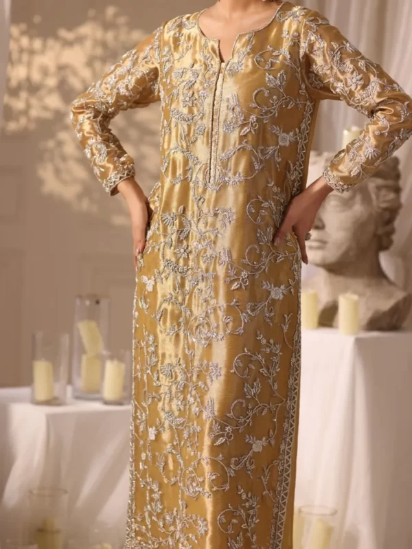 Luxury golden ethnic dress for women, featuring silver floral hand embroidery, full sleeves, and straight fit, ideal for festive occasions.