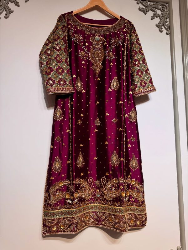 Luxury maroon ethnic dress with gold and silver hand embroidery, flared cut, CoutureCraze 2025.