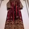 Luxury maroon ethnic dress with gold and silver hand embroidery, flared cut, CoutureCraze 2025.