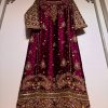 Luxury maroon ethnic dress with gold and silver hand embroidery, flared cut, CoutureCraze 2025.