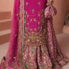 Closeup of golden embroidery detail on magenta CoutureCraze sharara set sleeves