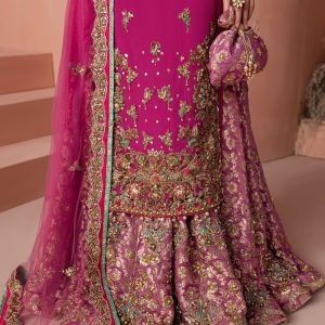 Closeup of golden embroidery detail on magenta CoutureCraze sharara set sleeves
