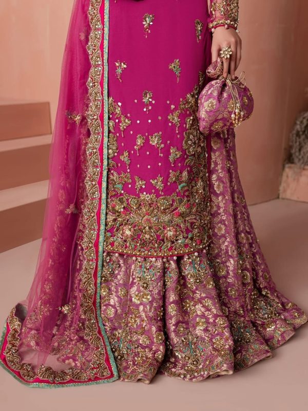 Closeup of golden embroidery detail on magenta CoutureCraze sharara set sleeves