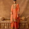 Full view of peach gold embroidered salwar suit set with ornate zari and sequin work