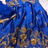 Royal blue silk kurta with intricate gold embroidery, paired with matching bottoms and a gold-bordered dupatta