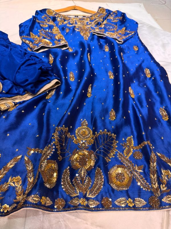 Royal blue silk kurta with intricate gold embroidery, paired with matching bottoms and a gold-bordered dupatta