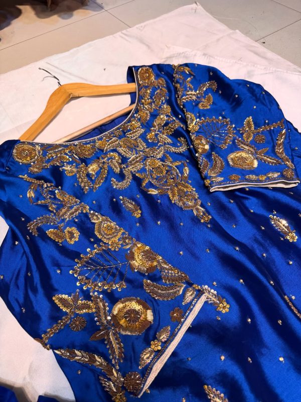 Royal blue silk kurta with intricate gold embroidery, paired with matching bottoms and a gold-bordered dupatta
