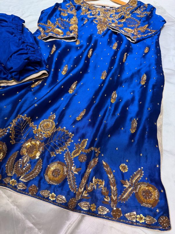 Royal blue silk kurta with intricate gold embroidery, paired with matching bottoms and a gold-bordered dupatta