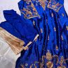 Royal blue silk kurta with intricate gold embroidery, paired with matching bottoms and a gold-bordered dupatta