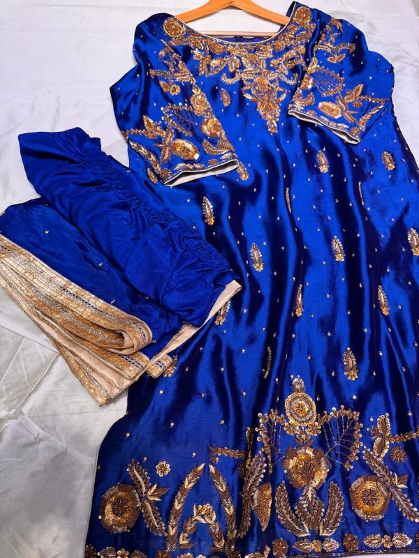 Royal blue silk kurta with intricate gold embroidery, paired with matching bottoms and a gold-bordered dupatta