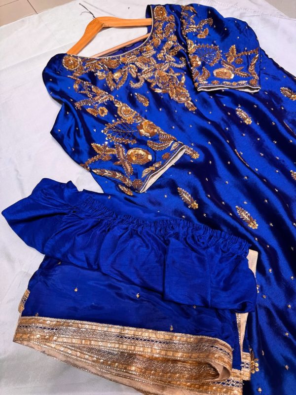 Royal blue silk kurta with intricate gold embroidery, paired with matching bottoms and a gold-bordered dupatta