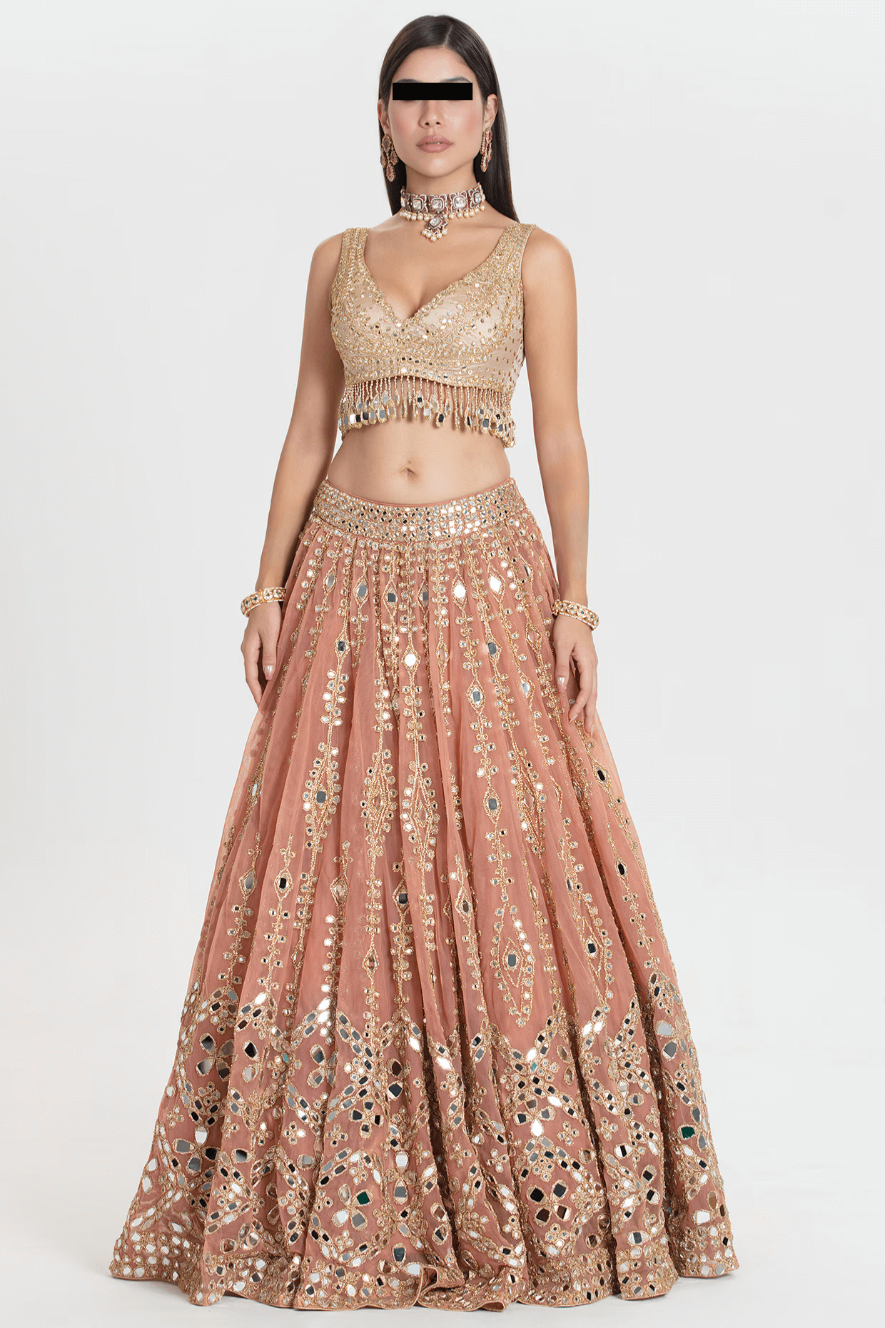 Blush peach net lehenga with gold sequin embroidery and mirror work by Couturecraze, paired with chanderi blouse and organza dupatta