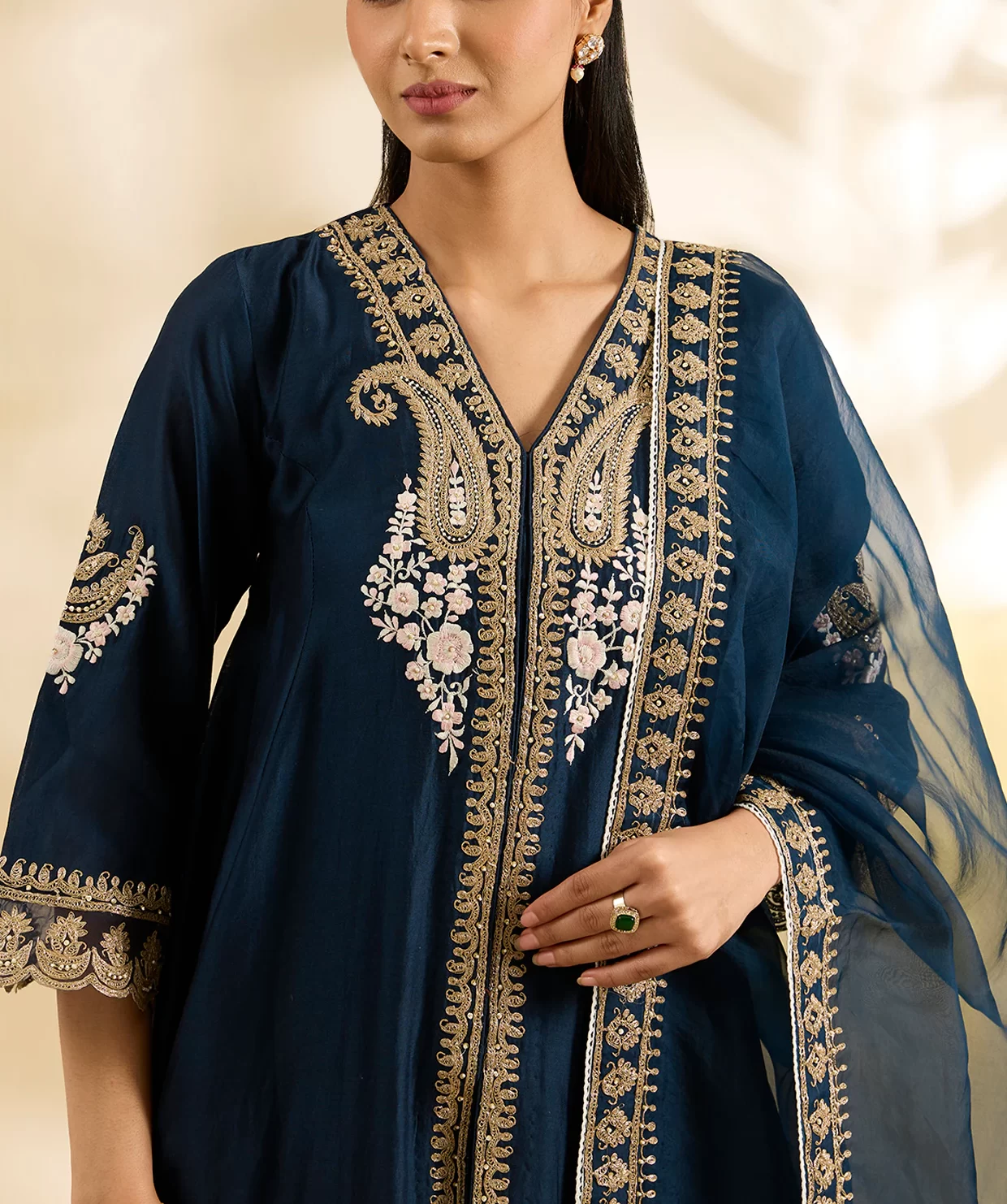 Close up of Kashmiri tilla embroidery on blue kalidar anarkali suit