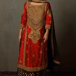 Red silk embroidered kurta set styled for Indian wedding