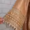 Golden Anarkali suit with intricate embroidery and dupatta